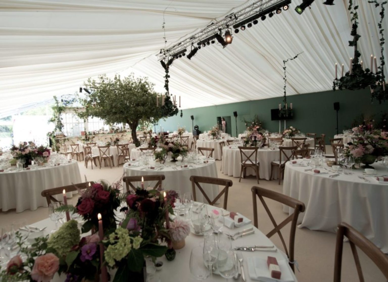 Flower Themed Wedding Marquee with Wooden Cross Backed Chairs